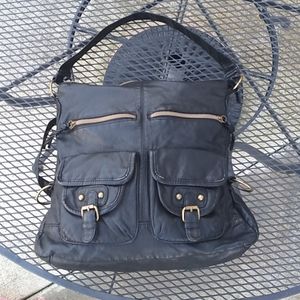 Black leather purse with bronze hardware.